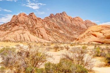 Beautiful view of Spitzkoppe bald granite peaks located between Usakos and Swakopmund in the Namib desert of Namibia