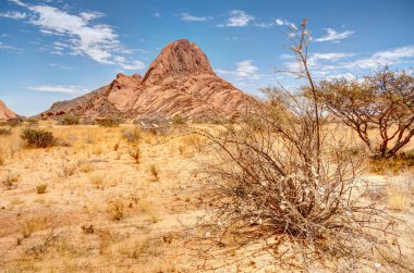 Beautiful view of Spitzkoppe bald granite peaks located between Usakos and Swakopmund in the Namib desert of Namibia