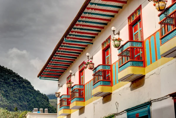 stock image Jardin, Colombia - May 2019: Historic colonial houses in Jardin, Colombia, showcase the town's cultural heritage with their unique architectural styles and lively colors.