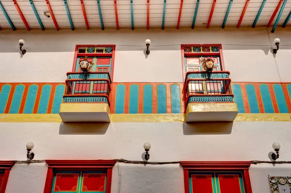 stock image Jardin, Colombia - May 2019: Historic colonial houses in Jardin, Colombia, showcase the town's cultural heritage with their unique architectural styles and lively colors.