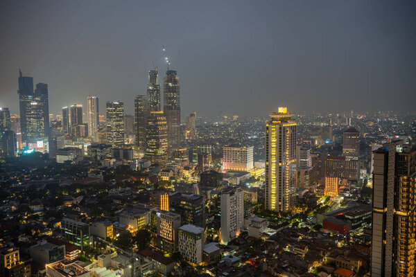 Jakarta, Indonesia - July 1, 2023 : Urban skyline at night, HDR Image
