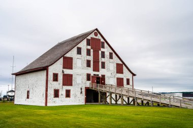 Paspebiac, Canada - July 2 2024 : Historical fishing village in cloudy weather, HDR Image clipart