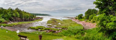 Cacouna, Quebec - July 1 2024 : Picturesque harbour on the Saint Lawrence River, HDR Image clipart