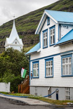 Seydisfjordur, Iceland - July 2 2024 : Historical village in cloudy weather, HDR Image clipart