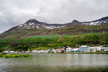 Seydisfjordur, Iceland - July 2 2024 : Historical village in cloudy weather, HDR Image clipart