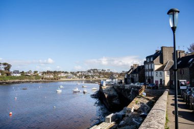 Le Conquet, France - March 03, 2024: Scenic view of the port city during sunny weather clipart