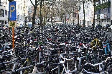 Many bicycles near Gent Sint-Pieters station in Ghent, Belgium clipart