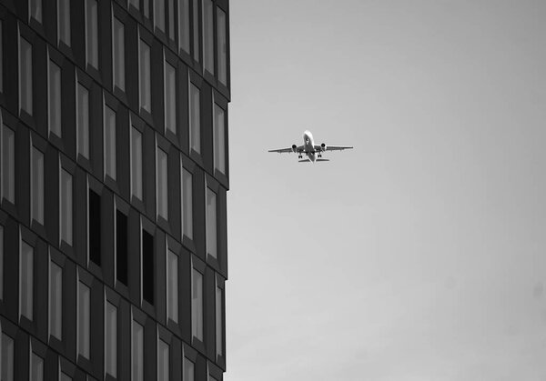 A large airplane flying high up in the air