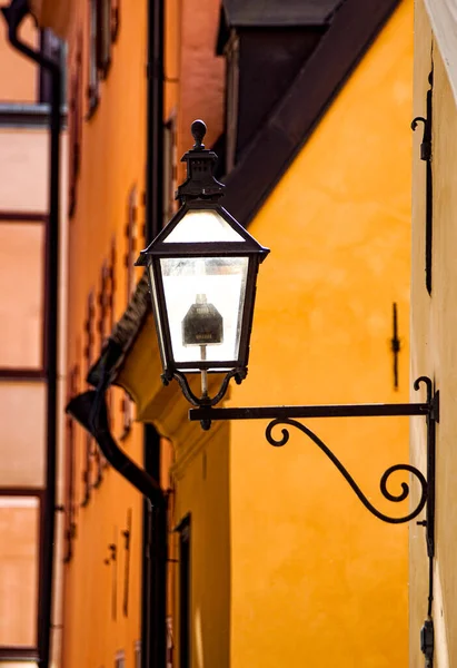 Low angle view of street light against building