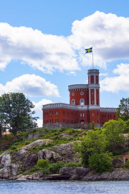 View of building by river against sky