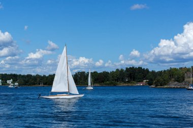 a small sail boat in the archipelago 