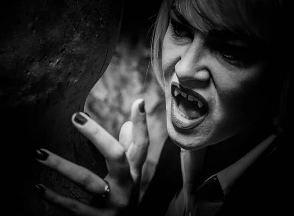 Close up of a a female Vampire in black and white