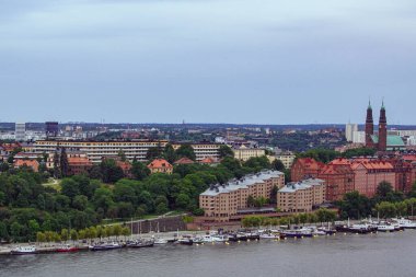 High angle view of buildings by river against sky
