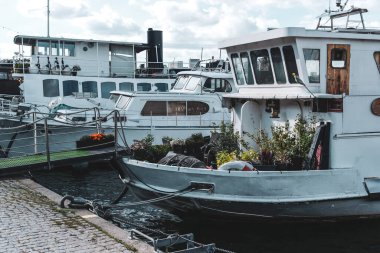 View of boats moored in canal against buildings