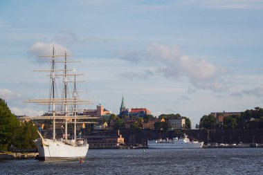 View of ship moored at harbor against sky