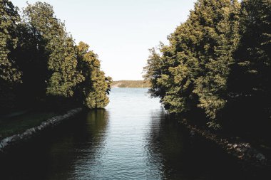 Scenic view of canal against clear sky