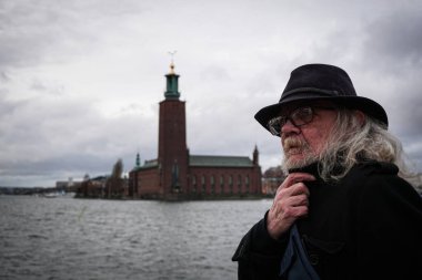 A man looking away against the sky