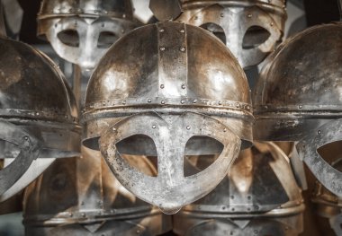 a picture of several old viking helmets