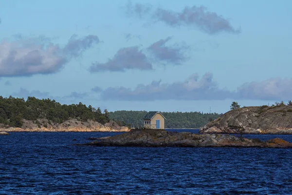 Small building on small island in archipelago