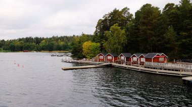 Small red buildings on island in the archipelago 