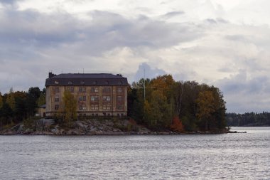 View of building by sea against sky