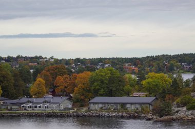 Scenic view of river by trees against sky