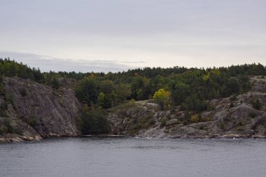 Scenic view of archipelago amidst trees against sky