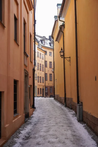 Stock image Empty alley amidst buildings in city during winter 