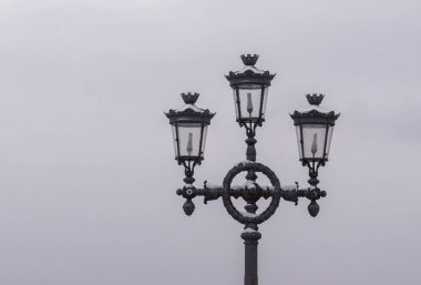 Low angle view of street light against cloudy sky