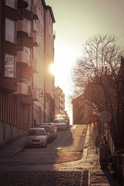 View of city street and buildings against sky