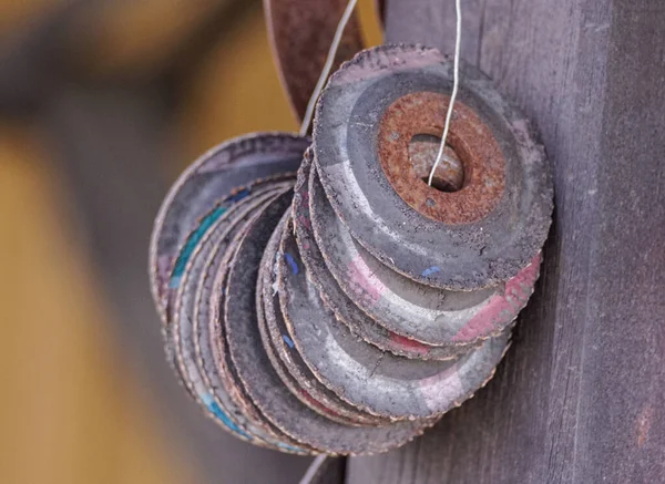 stock image Close up of old used grinding wheels hanging 