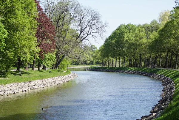 Stock image Scenic view of canal in park against clear sky