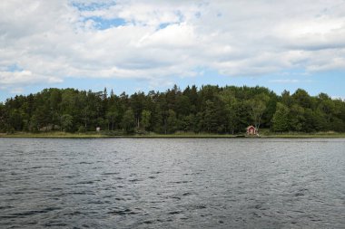 Scenic view of lake against cloudy sky