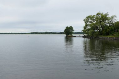 Scenic view of lake against cloudy sky