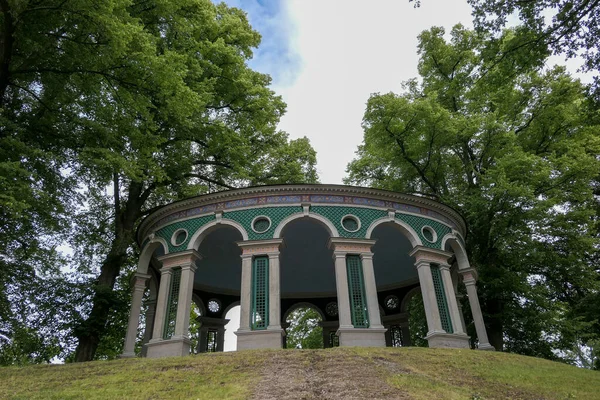 stock image a gazebo on a hill during the summer