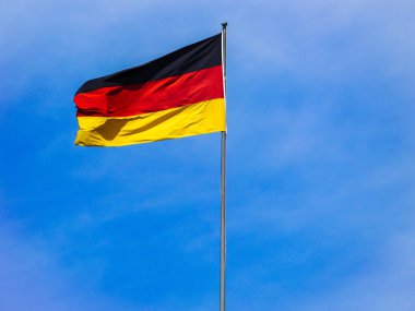 Low angle view of flag against blue sky