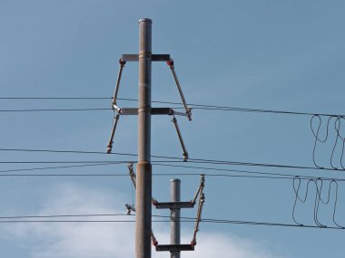 Low angle view of electricity pylon against sky