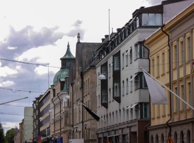 Low angle view of a buildings against cloudy sky 