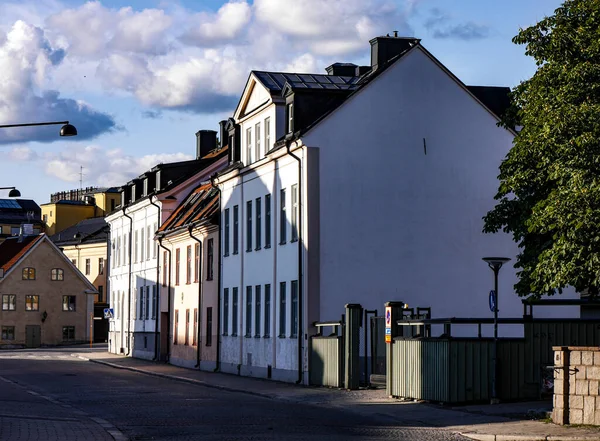 View of city street and buildings against sky
