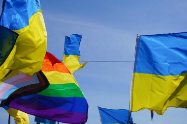 Low angle view of flags against the sky 