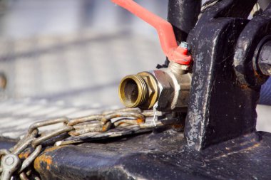 close up of water outlet with cobweb