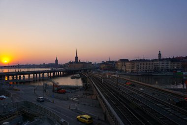 High angle view of railroad tracks against sky during sunset