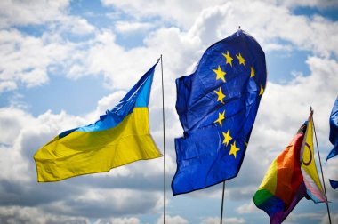 Low angle view of flags against sky