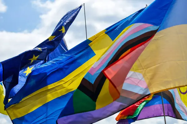 Low angle view of flags against sky