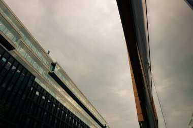 Low angle view of modern buildings against sky 