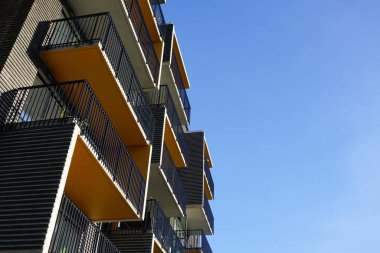 Low angle view of apartment building against the sky  clipart