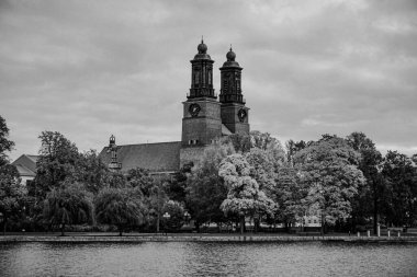 View of a beautiful church next to the canal in Eskilstuna  clipart