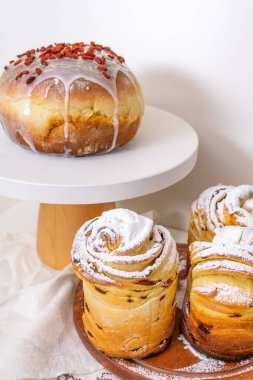 Easter cake and cruffins on white background with dried fruits on top