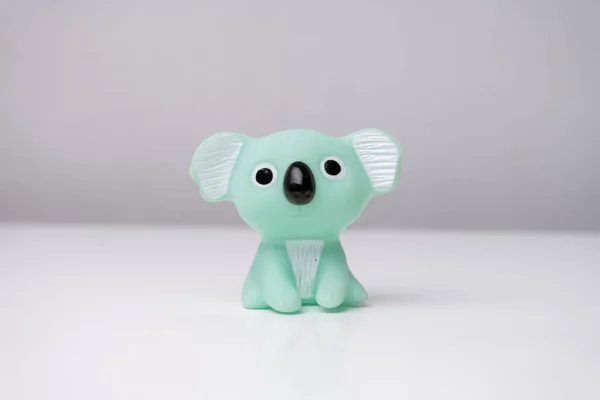 cute rubber koala toy on white table