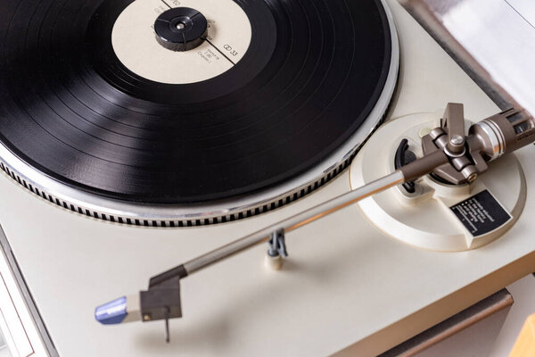 Closeup view on vintage vinyl record player with stylus